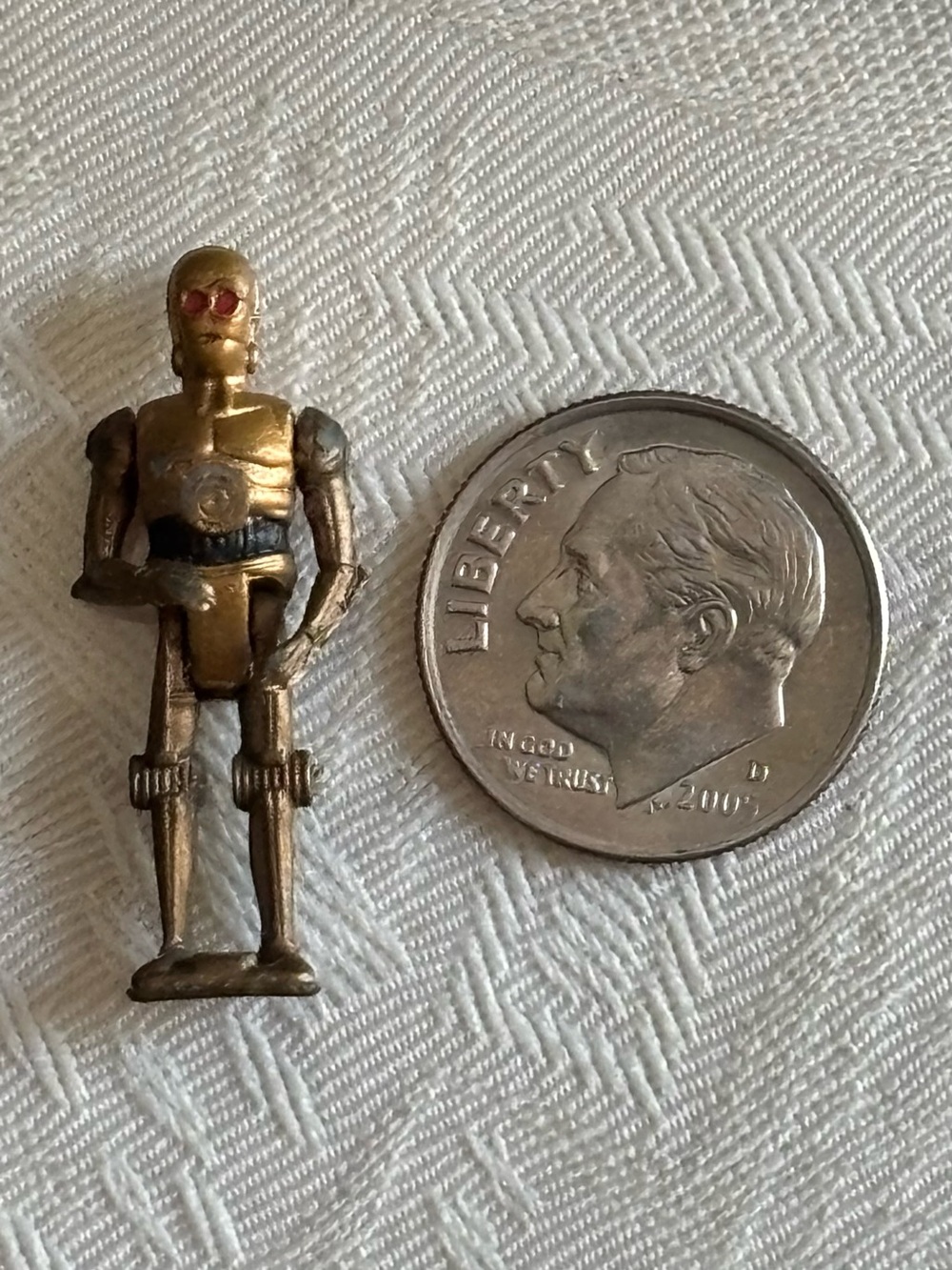 Collectible antique Star Wars C-3PO mini figurine, moveable toy